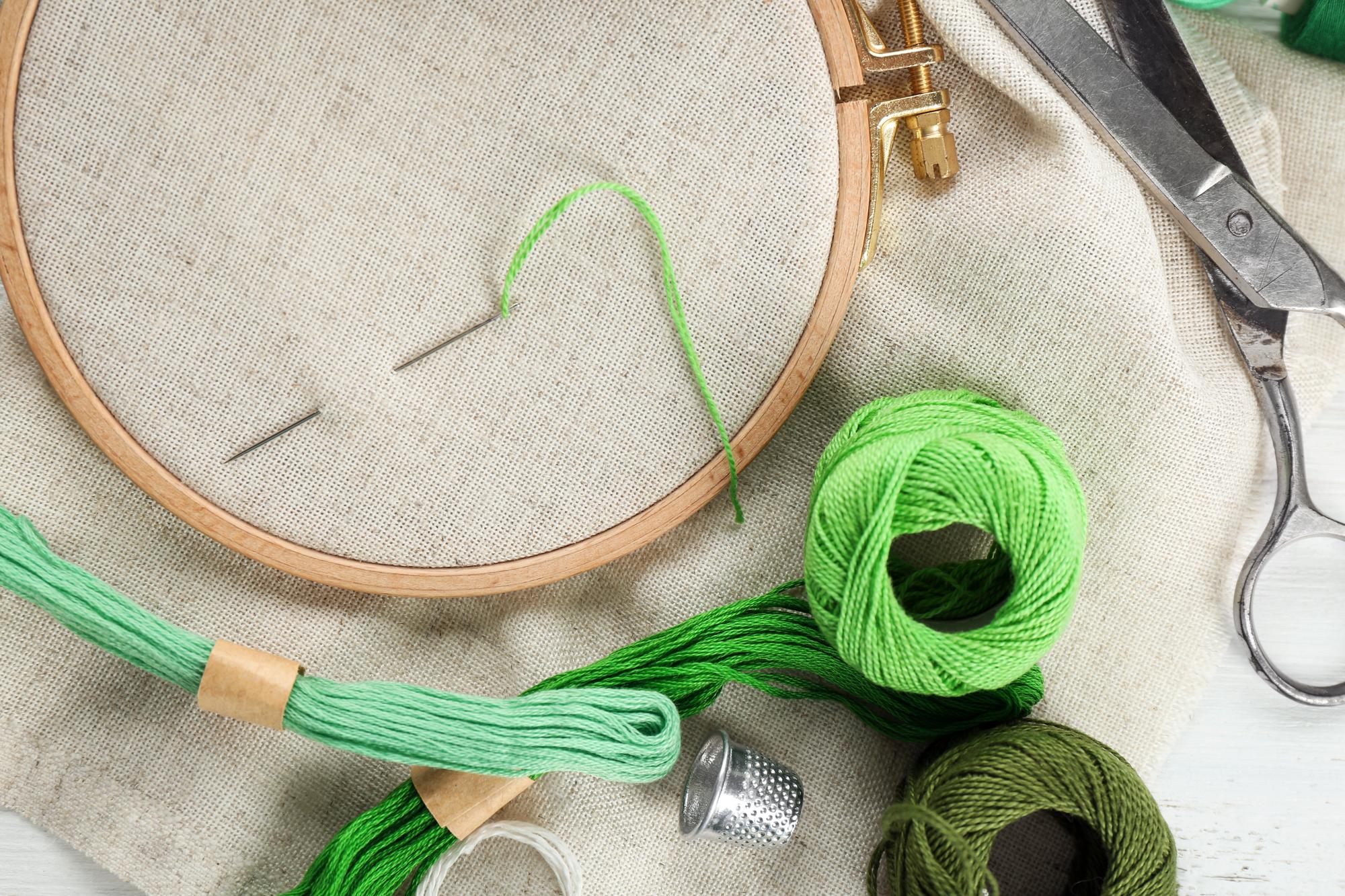 Artisan embroidery workshop with threads and hoops